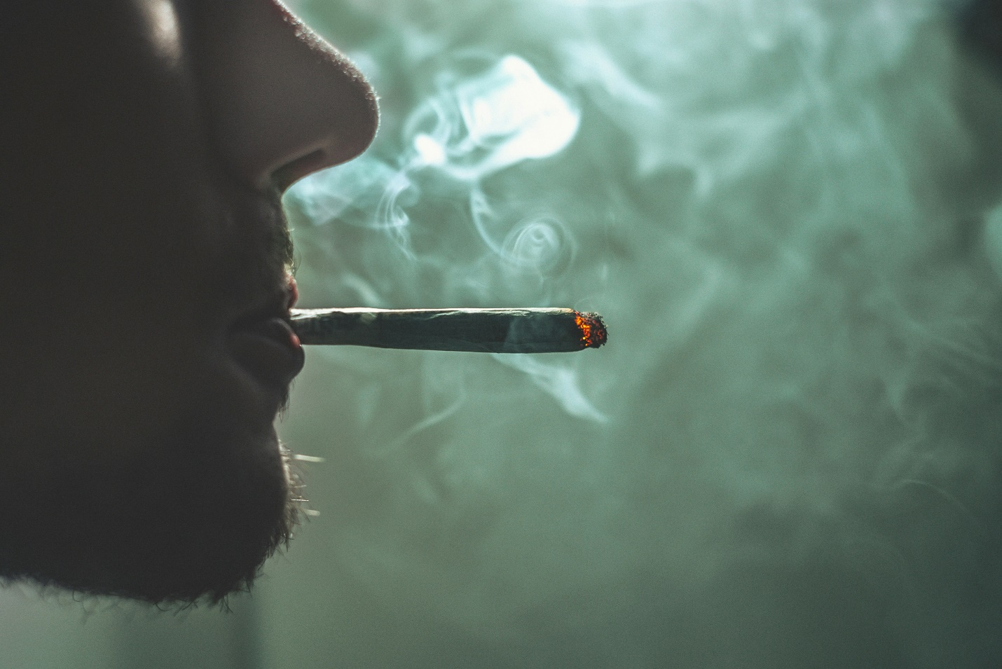 A man smoking a joint